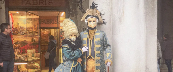 Two masked figures attending Venice Carnival, Italy
