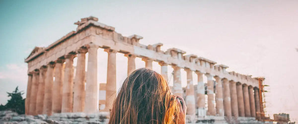 A woman looking at the Parthenon in Athens, Greece