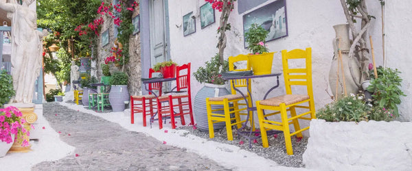 Red and yellow chairs on the street in Kos, Greece