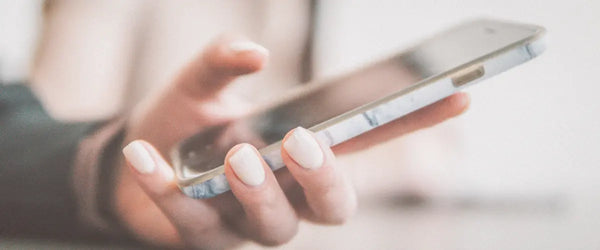 The hand of someone using a smartphone