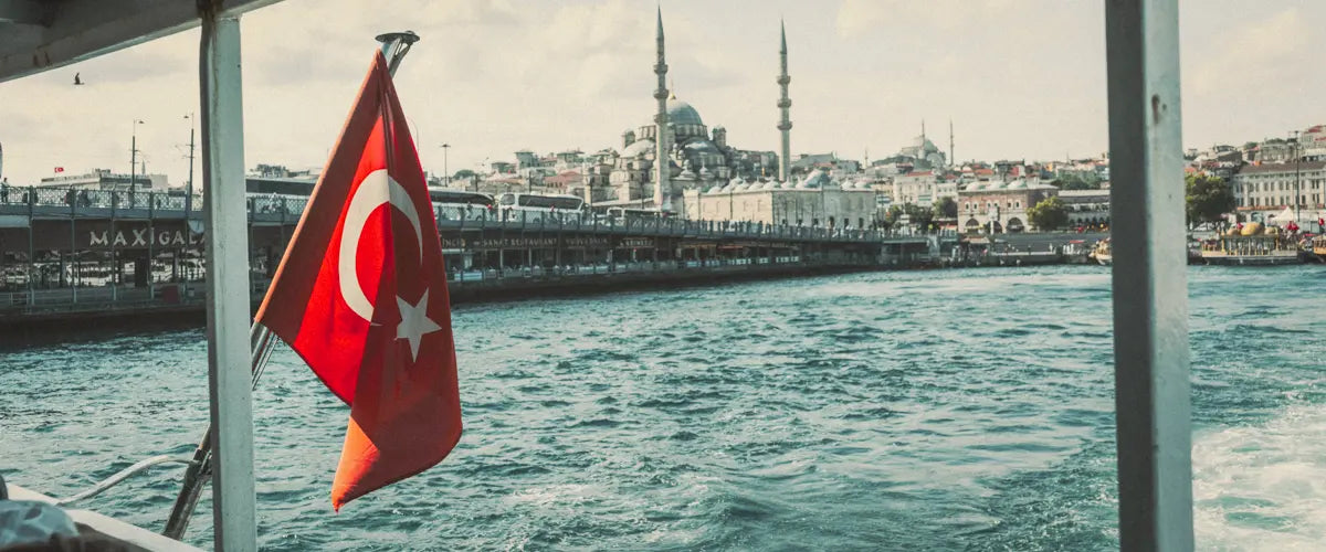 A Turkish flag next to the Galata Bridge in Istanbul, Turkey