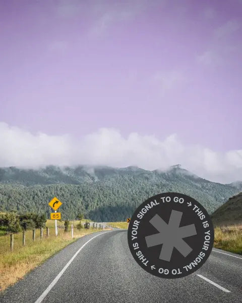 Scenic two-lane road winding through Fiordland National Park, New Zealand