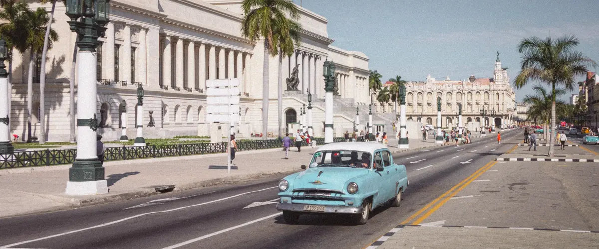 A classic American vintage car driving in Havana, Cuba