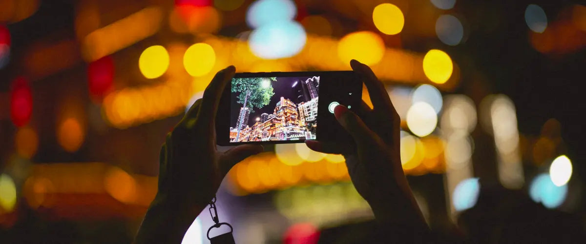 Someone using a smartphone to film an event in China