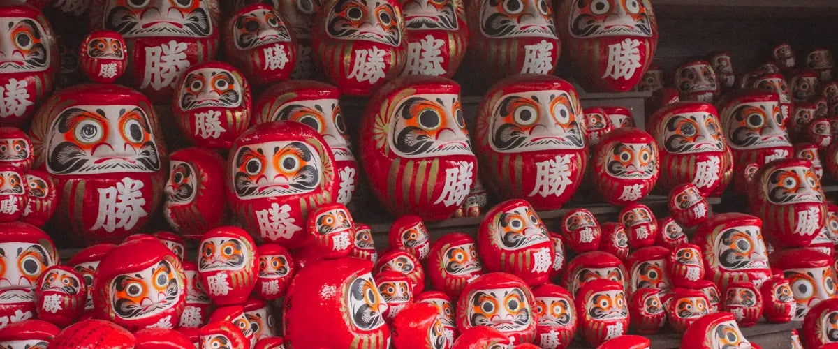 Daruma dolls, traditional talismans, at the Katsuo-ji temple, Osaka, Japan