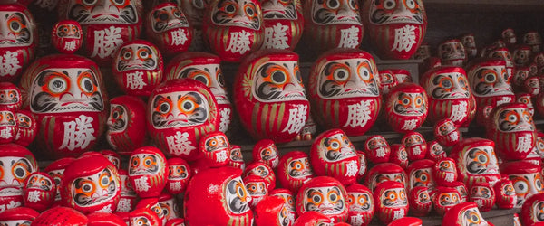 Daruma dolls, traditional talismans, at the Katsuo-ji temple, Osaka, Japan