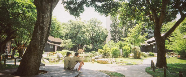 Two people sitting together in Hinoki Village, Chiayi City, Taiwan