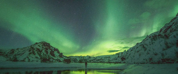 The Northern Lights over an Icelandic landscape