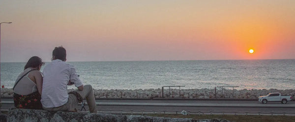 A couple watching the sunset in Cartagena, Colombia