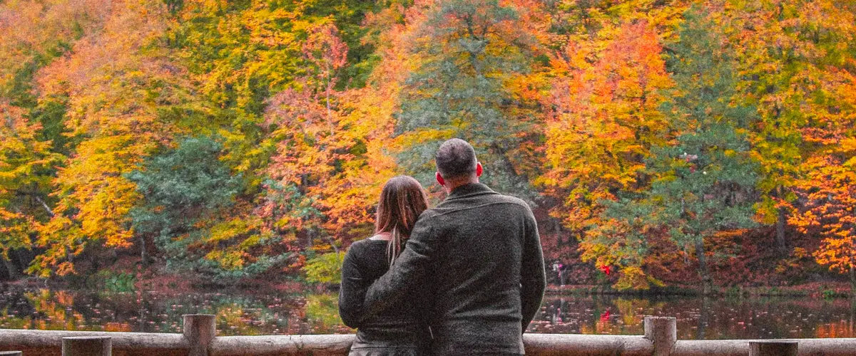 A couple standing together looking at a forest  in Yedigöller National Park, Turkey