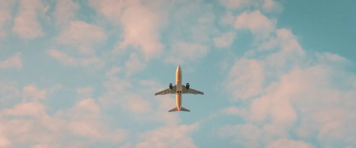 A plane mid-flight, photo taken from below