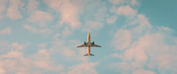 A plane mid-flight, photo taken from below