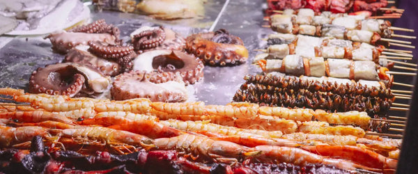 A platter of food available at a night market vendor in Zanzibar, an autonomous location in Tanzania
