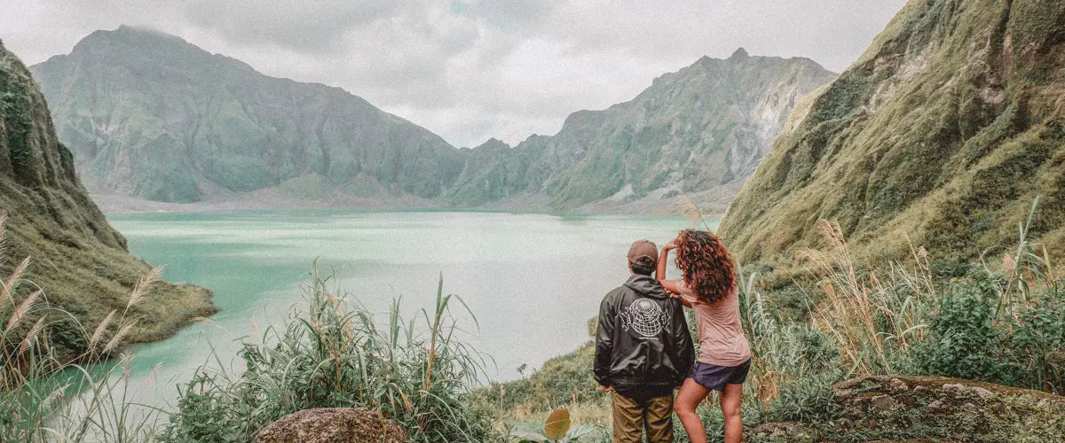 A people looking out across Crater Lake in the Philippines