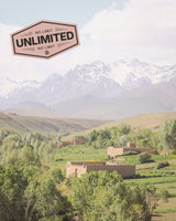 Afghanistan landscape featuring mountain scene and local buildings, promoting travel eSIM