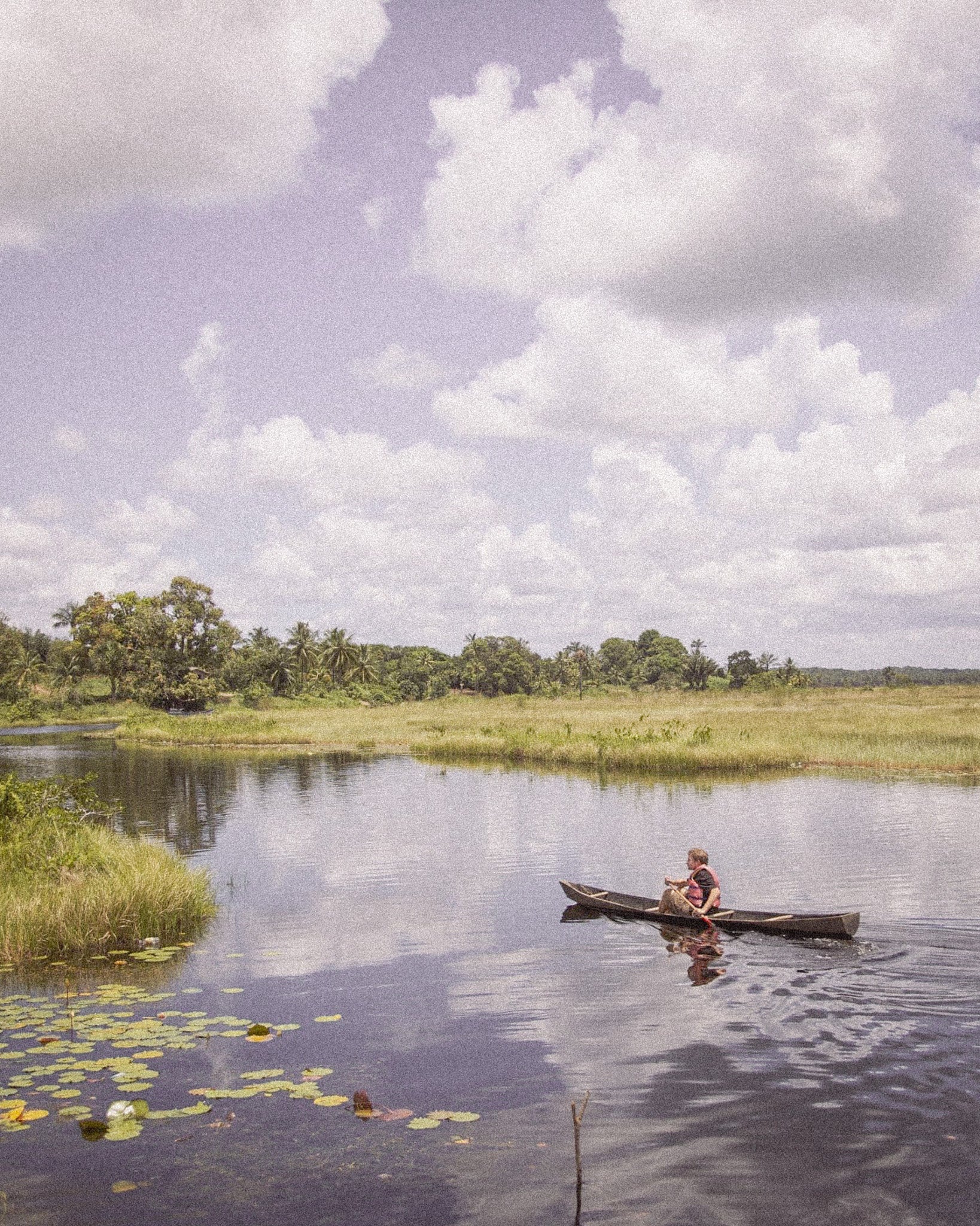 River in Guyana with kayaker, promoting SIMOVO eSIM